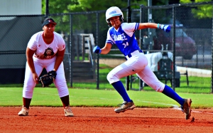 Chamblee's Kate Sarago (34) takes off to second in front of M.L. King first baseman Samantha Quintero. Sarago started the game with a bunt single. (Photo by Mark Brock)