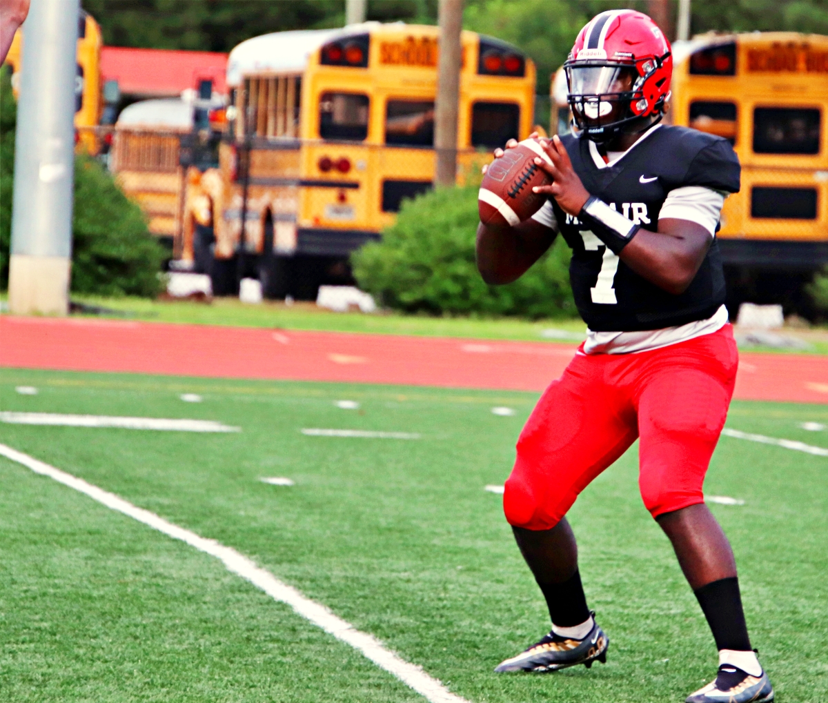McNair quarterback Jeremy Victor leads the Mustangs against the Druid Hills Red Devils in a battle of 1-0 teams on Friday at 7:30 on the field at North DeKalb Stadium. (Photo by Mark Brock)