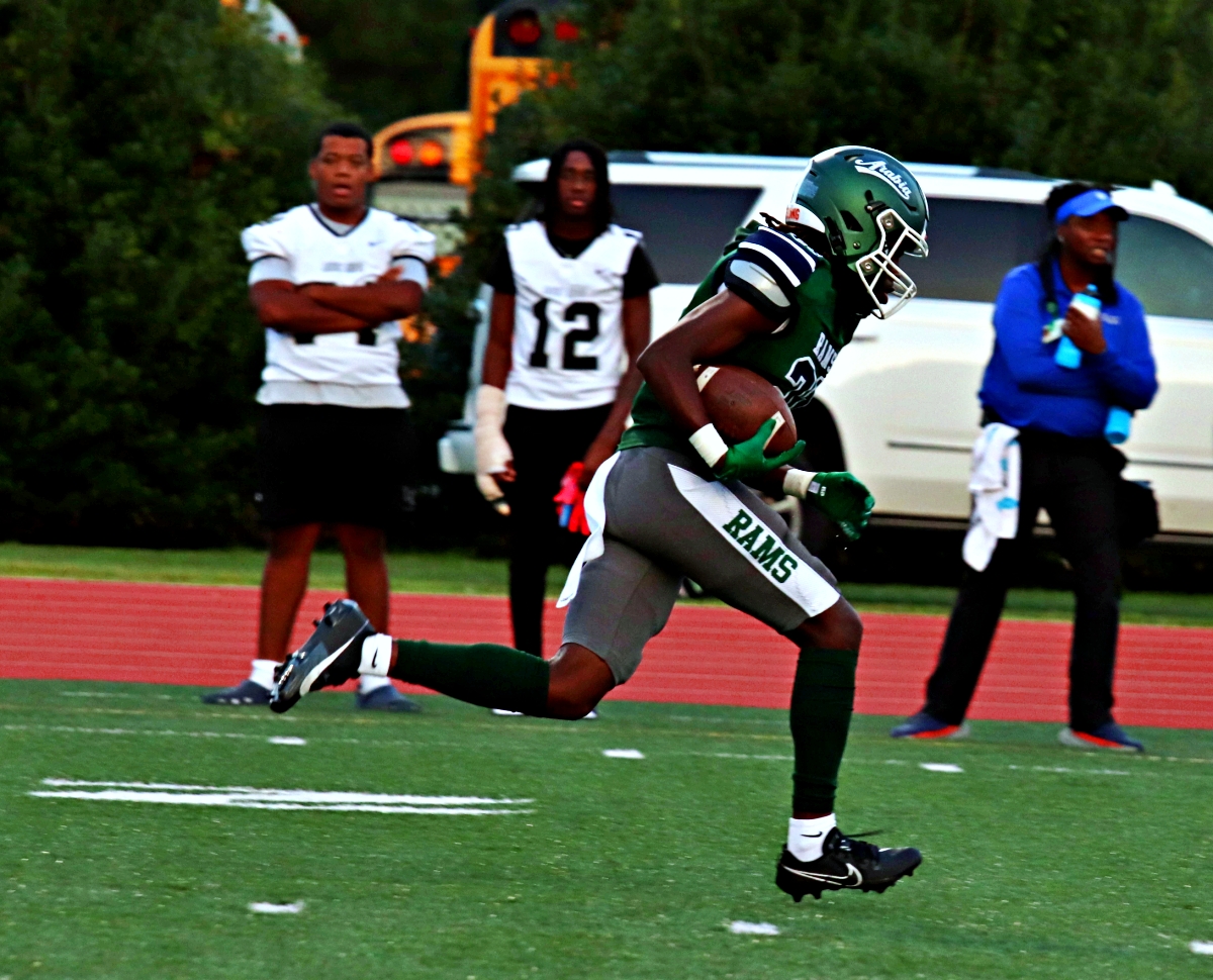 Arabia Mountain defensive back Kenneth Hollinger is off the races after intercepting a pass. He would go 85 yards for the touchdown on the pick-six. (Photo by Mark Brock)