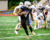 Chamblee quarterback Ashton Bolston (with ball) scrambles away against Dunwoody. Bolston and his Bulldog teammates look to get back on the winning track this week as they travel to Godfrey Stadium to take on M.L. King on Thursday at 7:00 pm. (Photo by Ken Langley)