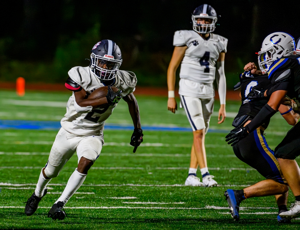 Dunwoody running back Malachi Cranshaw (2) headed for one of his three touchdowns on the night in Dunwoody's 39-7 win over Chamblee. (Photo by Ken Langley Photo)
