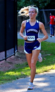 Dunwoody senior Claire Shelton ran to her third DCSD Girls' Cross Country Championship title in four years. (Photo by Mark Brock)