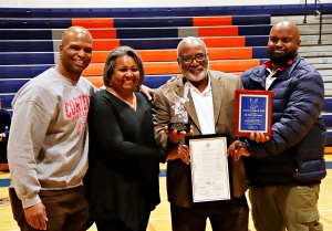 It was a family affair as Columbia High School dedicated its gym and floor as Dr. Phil McCary Gym and Court on Tuesday. Joining McCrary (third from left) were son Colonel Marcus Starks (former Towers QB), Constance McCrary (wife) and son Phillip "Clint" McCary Jr. Both sons attended the Naval Academy. (Photo by Mark Brock)