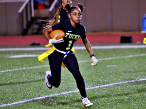 Nijah Lewis and her Tucker Tiger teammates are one of four DCSD flag football teams that play in the first round of the state playoffs on Tuesday. (Photo by Mark Brock)