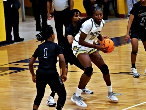 Southwest DeKalb's Jah'Neisha Spiers looks for room under the basket against a Stephenson Lady Jaguars' defender. Spiers led her Lady Panther teammates with 16 points in the 66-27 win. (Photo by Mark Brock)