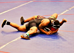 Southwest DeKalb's Isaiah Scott shown getting a pin in the county championships is trying to repeat as a state champion at the GHSA Class 5A State Wrestling Championships this weekend. (Photo by Mark Brock)