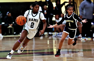Arabia Mountain's Charmaine Owens (2) gets past Decatur's Nadiya Mohamed (1) during first half action of the Lady Rams 66-29 championship win. (Photo by Mark Brock)