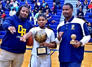 Coaches Stephon Broughton (left) and Ronald Moye (right) celebrate an undefeated and state title with two-time postseason MVP Mauri Barnes (middle). (Courtesy Photo)