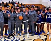 Southwest DeKalb girls' basketball head coach Kathy Richey-Walton (with ball) celebrates her 500th career victory with her 2024 staff and team following the win over Stephenson this week. (Courtesy Photo)