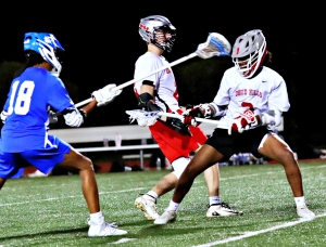 Druid  Hills' Ari Copeland (3) controls the ball against Chamblee's Jonas Maender (18). Copeland had four of the five goals for Druid Hills in the loss. (Photo by Mark Brock)