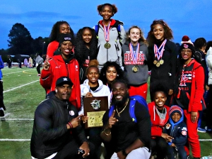 The Druid Hills Lady Red Devils rallied from sixth place to win their second consecutive DeKalb County Girls' Track and Field Championships title. They set two records and won five gold medals. (Photo by Mark Brock)
