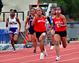 Druid Hills Sole Frederick (left) and Sanaa Frederick both ran record breaking times in the 200-meter dash with Sanaa getting the nod by 0.10 seconds. (Photo by Mark Brock)