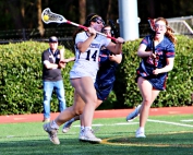 Lakeside's Reagan Flanagan (14) takes a shot as Dunwoody's Caroline Samuelson defends during Lakeside's 14-9 area win. Flanagan finished the night with eight goals and three assists. (Photo by Mark Brock)