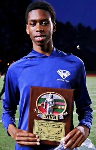 Southwest DeKalb's Amari Scott was named the JV County Championship's boys' MVP after setting records in both the 110 and 300 hurdles. (Photo by Mark Brock)