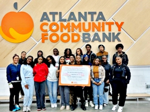 Southwest DeKalb tennis teams making a difference in the community helped at the Atlanta Community Food Bank warehouse preparing care boxes for those in need. 