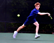 Dunwoody's Bobby Kitchin chases down a shot during his 3-hour and 45-minute marathon match he won 6-2, 4-6, 7-6 (7-3) to send the Wildcats to the Class 6A state semifinals. (Photo by Mark Brock)