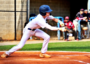 Chamblee's Sam Scazzero bunts against M.L. King during regular season Region 4-5A play. The Bulldogs and Lions along with Tucker and Cedar Grove open state playoffs today. (Photo by Mark Brock)