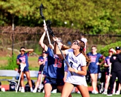 Lakeside's Marie Rollman (7) battles Dunwoody's Cara Eldridge (15) on a faceoff during regluar season play. Rollman and her Lady Viking teammates are making a second consecutive state playoff appearance. (Photo by Mark Brock)