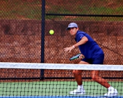 Dunwoody's Luca Ramondino makes a return during his No. 3 singles match. He was the only Wildcat to win a set in the semifinal loss to Johns Creek. (Photo by Mark Brock)